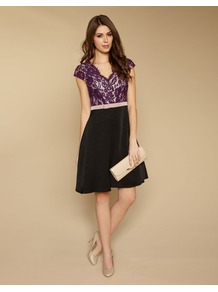 Olivia Lace Prom - style: shift; neckline: low v-neck; sleeve style: capped; fit: fitted at waist; waist detail: embellishment at waist/feature waistband; secondary colour: purple; predominant colour: black; occasions: evening, occasion; length: just above the knee; fibres: polyester/polyamide - mix; bust detail: contrast pattern/fabric/detail at bust; sleeve length: short sleeve; texture group: lace; pattern type: fabric; pattern size: standard; pattern: colourblock; embellishment: lace