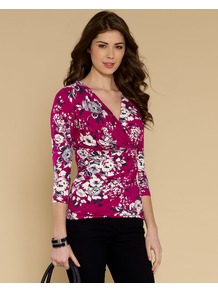 Francine Print Top - neckline: low v-neck; style: wrap/faux wrap; waist detail: twist front waist detail/nipped in at waist on one side/soft pleats/draping/ruching/gathering waist detail; secondary colour: ivory; predominant colour: hot pink; occasions: casual, evening, work; length: standard; fibres: viscose/rayon - stretch; fit: body skimming; sleeve length: 3/4 length; sleeve style: standard; trends: high impact florals; pattern type: fabric; pattern size: small & busy; pattern: florals; texture group: jersey - stretchy/drapey