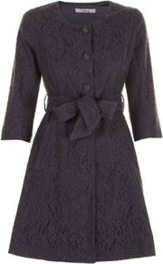 Dark Grey Mylie Lace Mac A - bust detail: added detail/embellishment at bust; hip detail: side pockets at hip; collar: round collar/collarless; style: mac; predominant colour: black; occasions: evening, occasion; fit: tailored/fitted; fibres: cotton - stretch; length: below the knee; waist detail: belted waist/tie at waist/drawstring; sleeve length: 3/4 length; sleeve style: standard; texture group: lace; collar break: high; pattern type: fabric; pattern size: small & busy; pattern: patterned/print; embellishment: lace