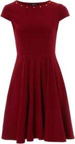 Studded Ponte Fit And Flare Dress Burgundy - neckline: round neck; sleeve style: capped; pattern: plain; bust detail: added detail/embellishment at bust; waist detail: fitted waist; predominant colour: burgundy; occasions: casual, evening, occasion; length: just above the knee; fit: fitted at waist & bust; style: fit & flare; fibres: polyester/polyamide - stretch; hip detail: structured pleats at hip; sleeve length: short sleeve; pattern type: fabric; pattern size: standard; texture group: jersey - stretchy/drapey; embellishment: studs