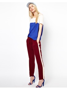 Sporty Trousers - length: standard; pattern: plain; style: tracksuit pants; waist detail: elasticated waist; pocket detail: small back pockets, pockets at the sides; waist: mid/regular rise; secondary colour: white; predominant colour: burgundy; occasions: casual, evening, holiday; fibres: polyester/polyamide - 100%; fit: straight leg; pattern type: fabric; pattern size: small & light; texture group: jersey - stretchy/drapey