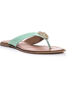 Kyra Sandals - predominant colour: pistachio; occasions: casual, holiday; material: leather; heel height: flat; heel: standard; toe: toe thongs; style: flip flops / toe post; finish: patent; pattern: plain; embellishment: chain/metal